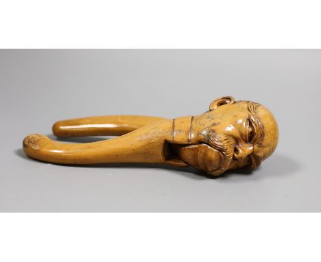 A novelty carved wood, portrait nutcracker, 21.5 cms high,