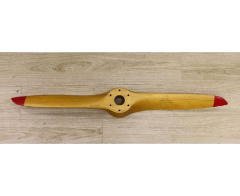 A Sensenich Corp laminated wooden propellor with red painted tips, P/N-22048, model no-276-17 serial no.-17991,112cms long,