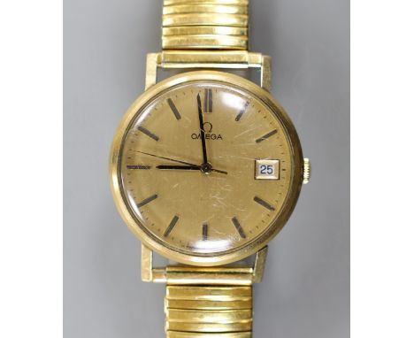 A gentleman's 1960' yellow metal Omega manual wind wrist watch, with date aperture, on associated flexible bracelet, no box o