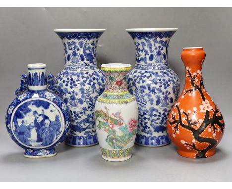 A pair of Chinese blue and white vases, two other vases and a moon flask, tallest 28cm