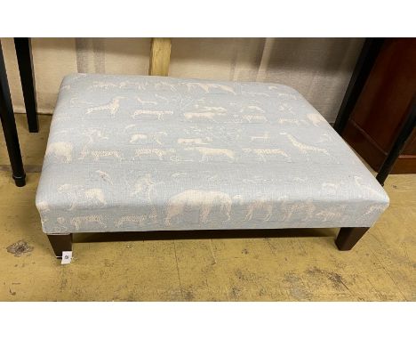A contemporary rectangular footstool upholstered in Andrew Martin animal print fabric, width 103cm, height 80cm