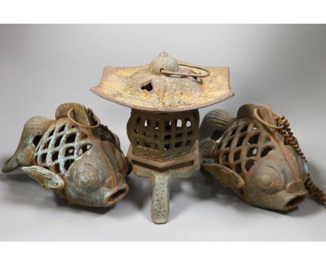 A Japanese iron lantern and two similar koi