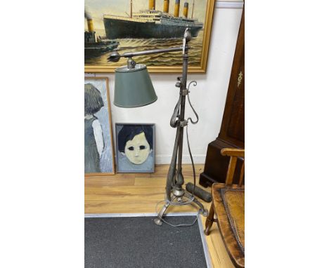 An Art Nouveau style wrought iron telescopic lamp standard