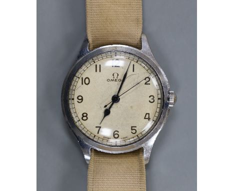 A gentleman's early 1940's stainless steel Omega manual wind wrist watch, on associated fabric strap.