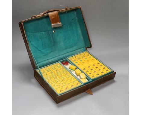 A 1920's leather travelling mahjong set