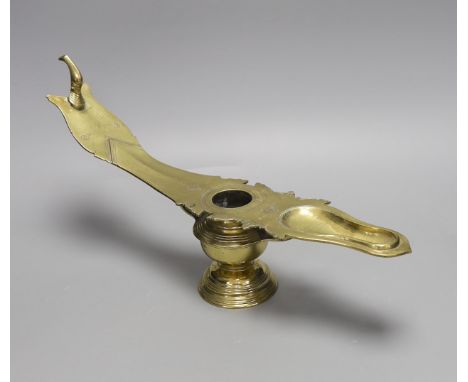 A 19th century Indian brass oil lamp, 45 cms wide