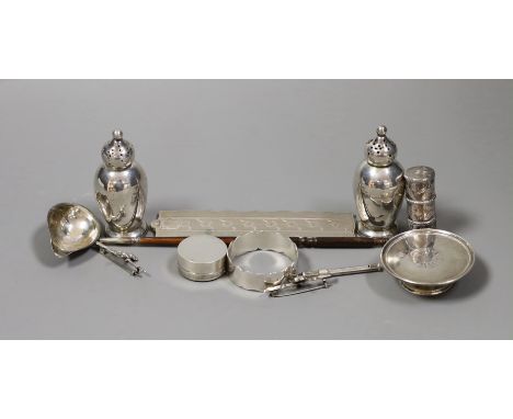 A quantity of small silver or white metal items including a long handled server spoon, Chinese pepperette, pair of Victorian 