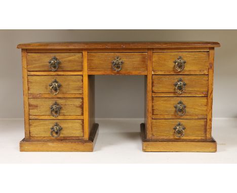 A late 19th century walnut model of a pedestal desk. W- 48cm, H - 27cm, D - 22cm
