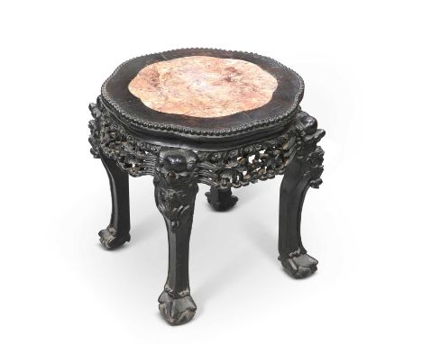A CHINESE MARBLE-INSET HARDWOOD STAND, CIRCA 1900 the shaped top with beaded edge, above a foliate carved pierced apron, rais