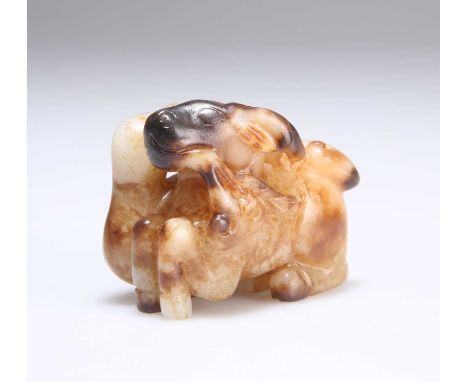 A CHINESE CARVED JADE GROUP depicting a recumbant crane and deer. 5cm long, 4cm high