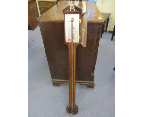 A modern inlaid mahogany stick barometer, the face inscribed A Comitt