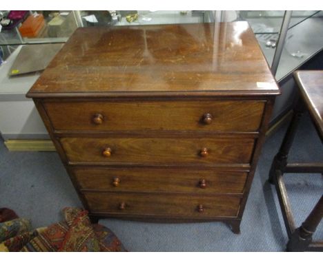 A late Victorian mahogany, all proportioned chest of four graduated long drawers, with turned handles, raised on splayed brac