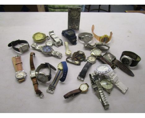 A quantity of assorted fashion wristwatches, a compass and a dressing table clock