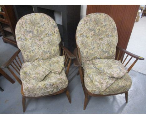 Two mid 20th century dark Ercol armchairs