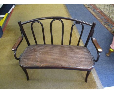 An early 20th century bentwood child's sofa