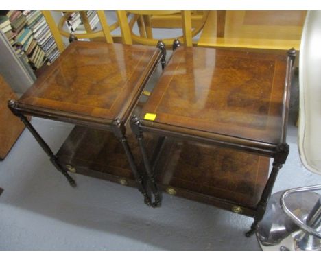 A pair of modern mahogany and walnut, two tier lamp table with a drawer