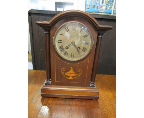 An Edwardian mahogany mantle clock with a 4 1/2 silvered dial, Roman numerals and German movement, striking on a gong, 12 1/2