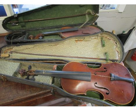 Two early 20th century violins and bows, one with the label reading copy of Antonius Stradivarius, 23 1/4 l, the other with l