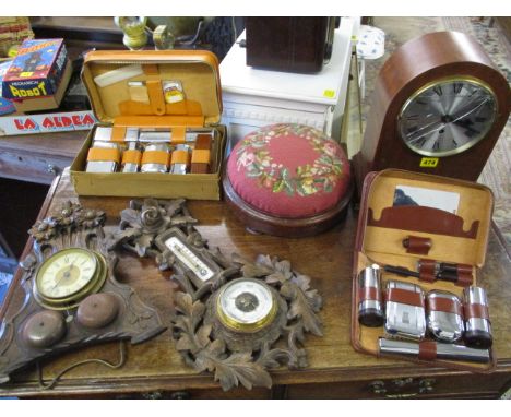 A mixed lot to include a mahogany cased mantel clock, a tapestry upholstered mahogany stool, two leather cased vanity cases, 