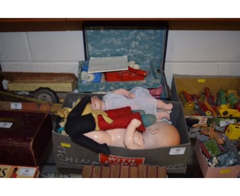 A shoe box and a miniature trunk containing various dolls and accessories to include Armand Marseille 