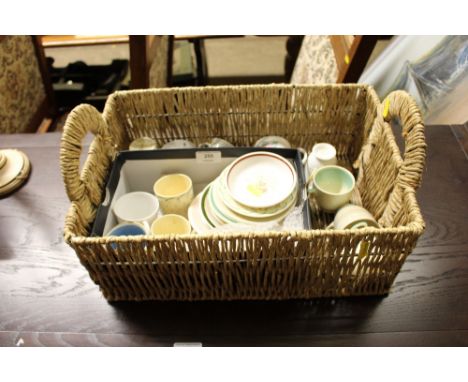 A box and basket of mostly Susie Cooper coffee cups and saucers 
