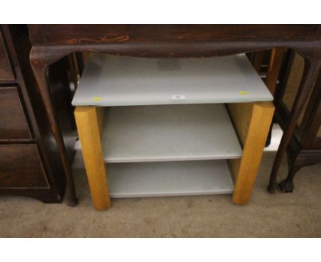 A glass and light oak veneered three tier table 