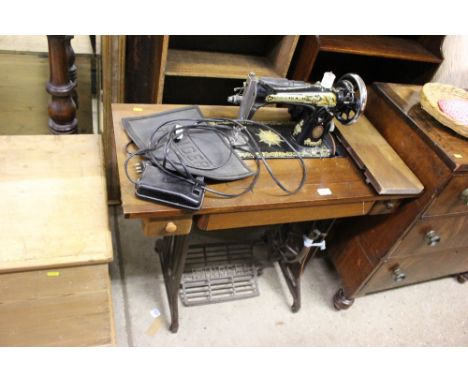 A Singer sewing machine table - sold as collector's item