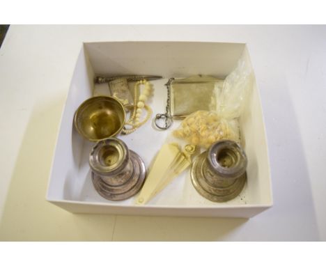 A Sterling silver card case; a pair of silver dwarf candlesticks; a Victorian silver vesta case etc. 
