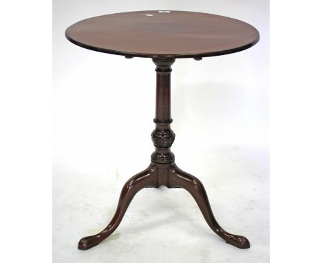 A MAHOGANY CIRCULAR TILT TOP TRIPOD TABLE on turned column support, 57cm diameter