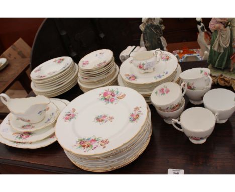 A COALPORT JUNETIME PART DINNET SERVICE with dinner plates, side plates, dessert plates, bowls, a sauce boat and stand and cu