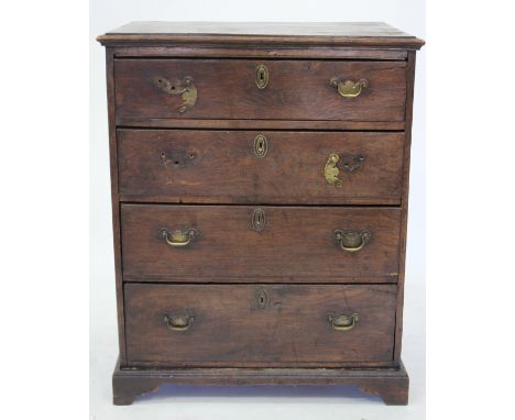 AN 18TH CENTURY OAK CHEST the top with a moulded edge above four graduated long drawers, bracket feet 70cm wide 