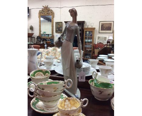 FOUR LLADRO PORCELAIN FIGURINES to include 'Rose Ballet' 05919, number 4828, number 4.915 and number 06175 and a Nao figurine