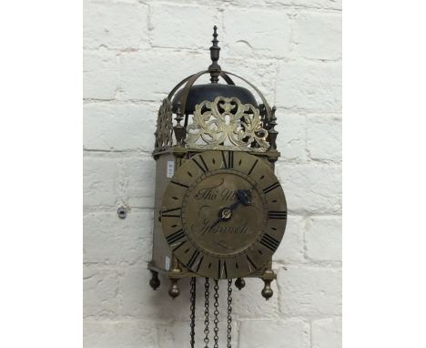 A 17TH CENTURY STYLE BRASS AND IRON LANTERN CLOCK the dial with Roman numerals, signed Thomas Moore of Ipswich, complete with