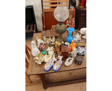 A QUANTITY OF VARIOUS MISCELLANEOUS ORNAMENTS to include a Nao figure of a girl in a wedding dress, two pottery cows, a bisqu