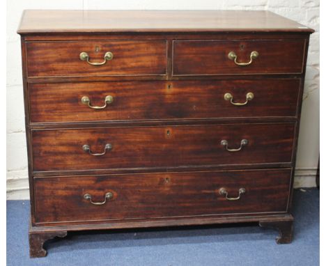 A VICTORIAN MAHOGANY CHEST of two short and three long drawers with brass swan neck handles and bracket feet 124cm wide 