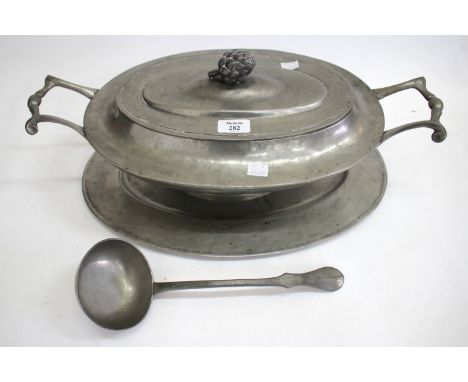 A PEWTER OVAL TUREEN COVER, STAND AND A LADLE, together with two pairs of brass candle sticks, a blue and white meat platter,