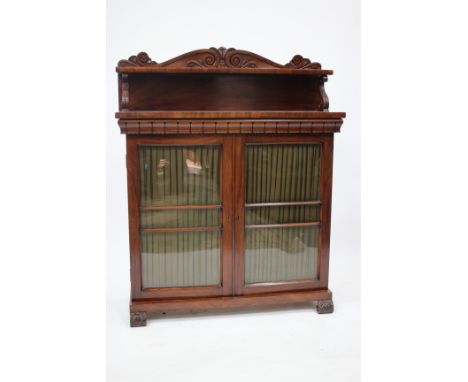 A WILLIAM IV OR EARLY VICTORIAN MAHOGANY CHIFFONIER, the raised back with scroll decoration and the shelf with scroll support