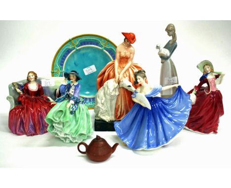 A FABRIQUE ITALIA POTTERY FIGURINE of a lady in an orange dress with a dog 26cm in height, four Royal Doulton figurines, Swee