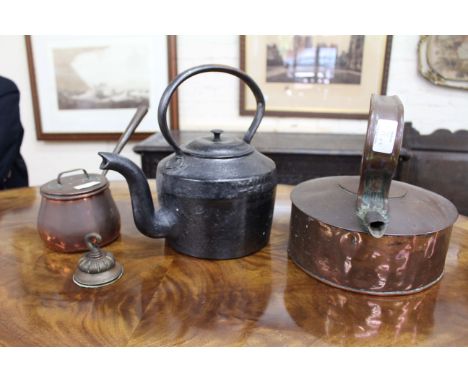AN OLD COPPER KETTLE together with a small copper saucepan and lid, an iron kettle, an oak wall hanging aneroid barometer (4)