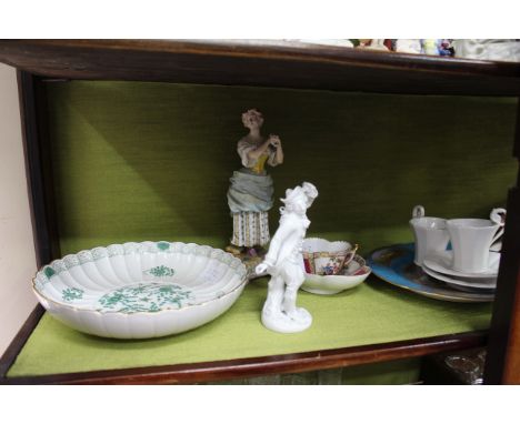 A PAIR OF GERMAN PORCELAIN FIGURES of a young man with dead game and a girl with grapes, a pair of Continental white glazed f