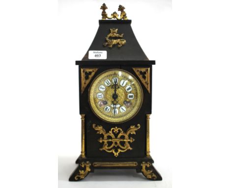 A HOWELL JAMES & CO OF LONDON EBONISED PINE MANTEL CLOCK with gilt mounts, the gilt dial with inset enamelled Roman numerals,