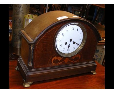An inlaid striking mantel clock - 27cm high 