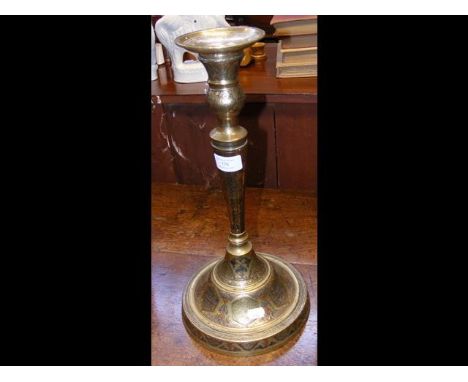 An Islamic decorative brass and metal candlestick - 40cm high 