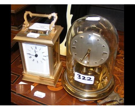 A 14cm high brass cased carriage clock, together with a dome top clock  