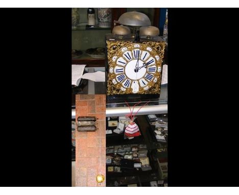 An antique French comtoise clock with pendulum and weights 