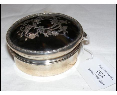 A 7.5cm diameter tortoiseshell and silver trinket box 