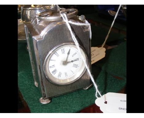 A silver cased travelling clock - 8cm high CONDITION REPORTnot working