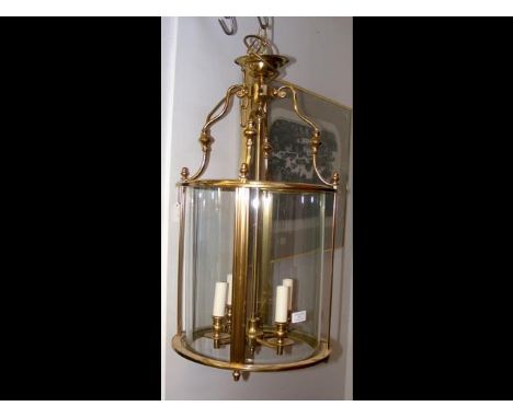 A large metal and glass porch lamp 