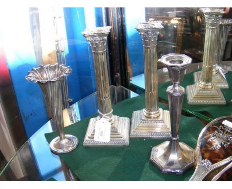 A silver vase, silver candlestick, together with a pair of Corinthian column plated candlesticks 