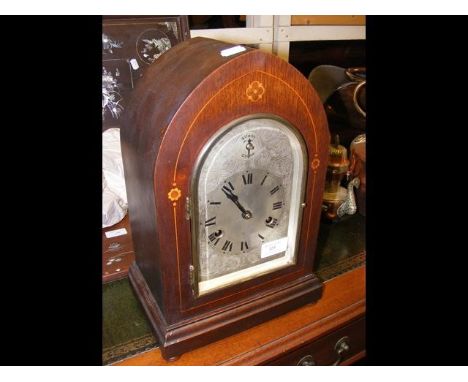 A 36cm high lancet shaped striking mantel clock with silvered dial 